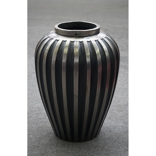 A modern polished steel ribbed baluster vase, 61cm high.