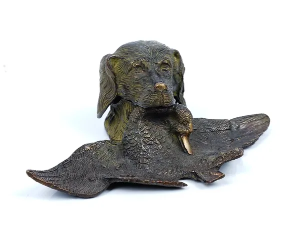 A novelty patinated bronze inkwell, third quarter 19th century, cast in the form of a retriever's head, hinged and enclosing the well, a dead duck in