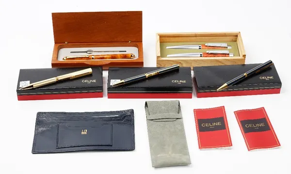 Three Celine, Paris, ballpoint pens, each boxed, a Laguiole fountain and ballpoint pen set, boxed, a brown lacquered ballpoint pen, boxed with refill,