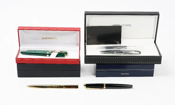 A Caran d'ache black laque de chine fountain pen, with booklet and refill, a Bvlgari ballpoint pen, with booklet and refills, two green marbled ballpo