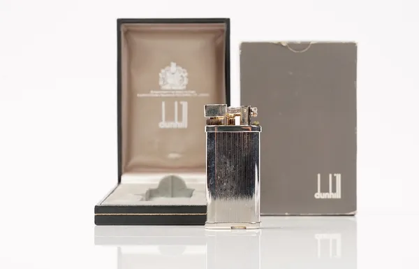 A Dunhill silver plated 'unique' gas lighter, with box, booklet and outer box.