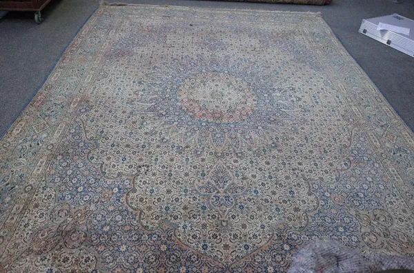 A Kerman carpet, Persian, the Mina Hani field with a multifaceted medallion, matching spandrels; a pale indigo border of diamonds and palmettes, 380cm