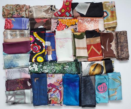 A collection of various printed silk scarves including film related silk examples by Euro Disney; The Royal Society for the Protection of Birds and Cl