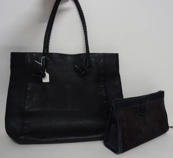 A Gucci lady's black leather tote shoulder bag, model number 267903, with plaited leather straps, to a canvas lined interior, fitted a zip and two int