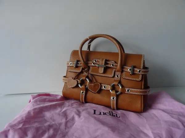 A Luella 'Giselle' tan leather handbag, with twin leather loop handles and strap decoration, the flap opening to reveal a fabric lined interior.