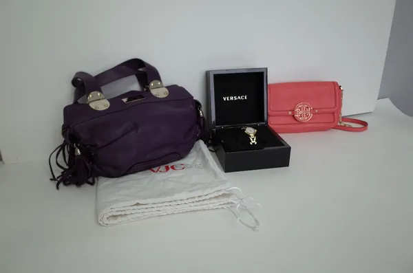 A Versace VJC purple leather twin handled handbag, with silver-tone hardware and applied tassels, the zipped top opening to reveal a purple fabric lin