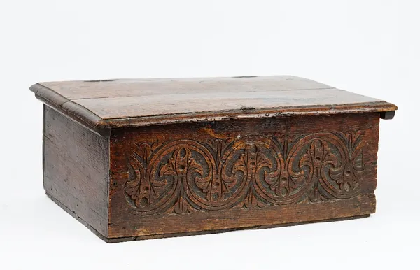 A 17th century oak bible box with carved front panel, 59cm wide x 23cm high.