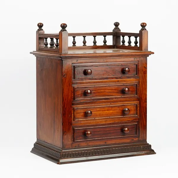 A 19th century walnut table top chest with a galleried top over four long graduated drawers, adapted, 40cm wide x 50cm high.