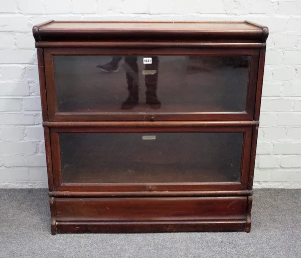 The Globe Wernicke Co Limited, a two section mahogany bookcase with up and over glazed doors, 87cm wide x 90cm high..