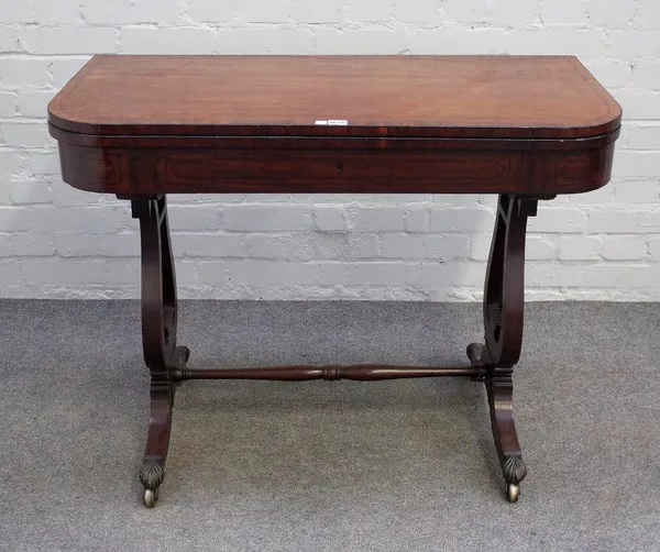 A Regency inlaid mahogany D-shaped tea table on lyre supports united by a turned stretcher, 100cm wide x 75cm high.