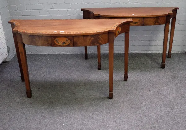 A pair of George III and later floral polychrome painted mahogany serpentine console tables on tapering square supports, 124cm wide x 71cm high.