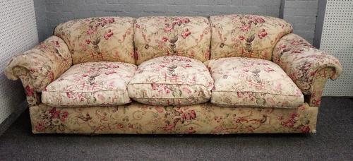 George Smith, a large triple hump back sofa in floral pattern upholstery, 250cm wide x 85cm high.