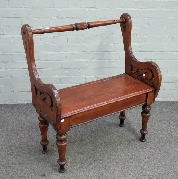 A Victorian Arts and Crafts stained oak box seat hall bench with turned back rail and supports, 90cm wide x 93cm high.