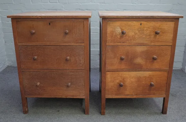 Possibly Heals; a pair of early 20th century limed oak three drawer chests, on block supports, adapted, 61cm wide x 84cm high, (2).