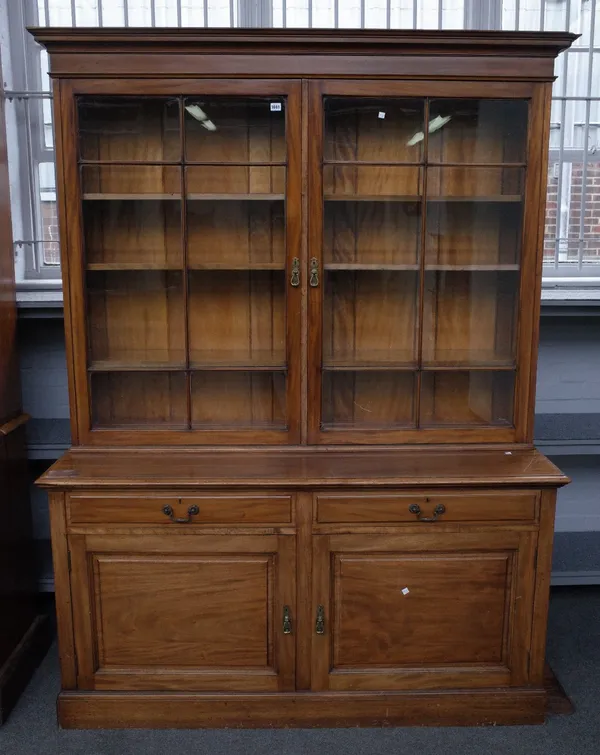 A late 19th century mahogany bookcase cabinet, with pair of glazed doors over drawers and cupboards, 164cm wide x 214cm high.