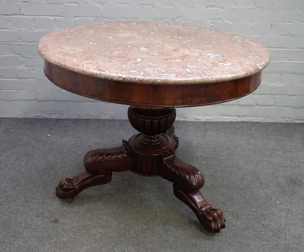 A 19th century French gueridon, the circular marble top on a mahogany base, with semi fluted baluster turned column and three paw feet, 90cm diameter