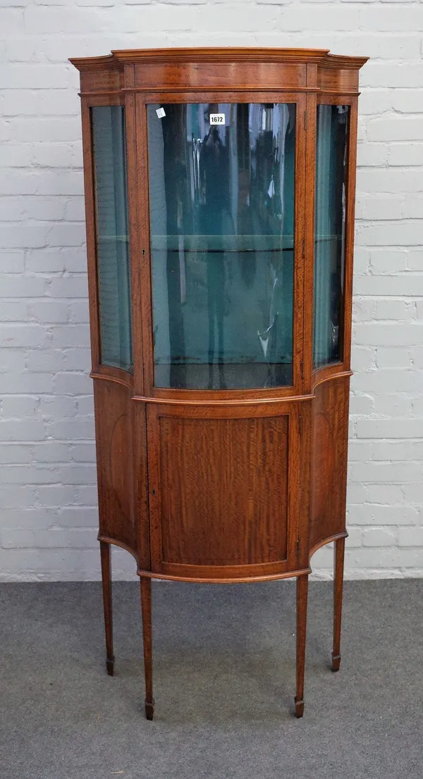 An Edwardian inlaid satinwood serpentine fronted display cabinet/cupboard on tapering square supports, 71cm wide x 166cm high.