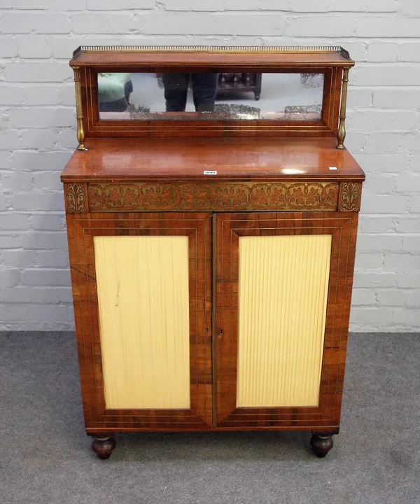 A Regency brass inlaid rosewood and mahogany chiffonier with mirrored ledge back over a pair of cupboards on turned feet, 74cm wide x 115cm high.