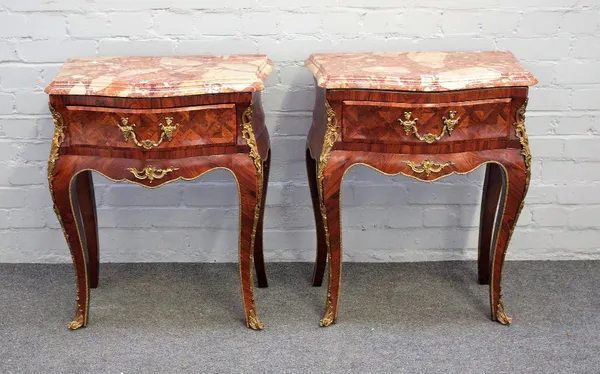 A pair of Louis XV style gilt metal mounted kingwood marble top bedside tables, each with bombe single drawer base on cabriole supports, 60cm wide x 7