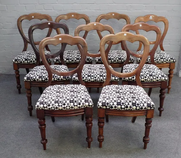 A set of nine Victorian mahogany balloon back dining chairs, on turned supports, 43cm wide x 86cm high (9).