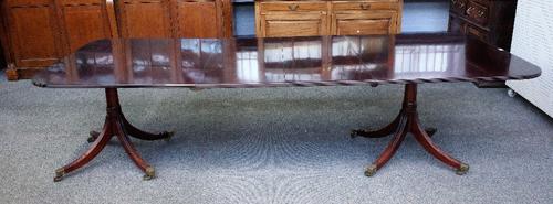 William Tillman; a George III style mahogany D-end extending dining table, with pair of turned columns and eight downswept supports, two extra leaves,