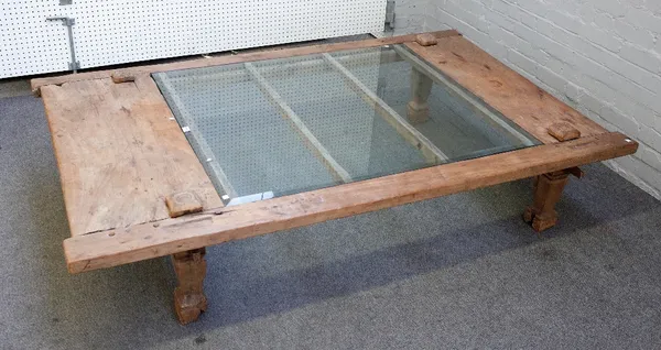 A large glass inset rectangular coffee table constructed with 19th century Eastern reclaimed hardwood, 199cm wide x 44cm high.