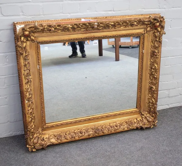 A 19th century rectangular gilt frame with moulded scroll chased decoration and later mirror plate, 100cm wide x 89cm high.