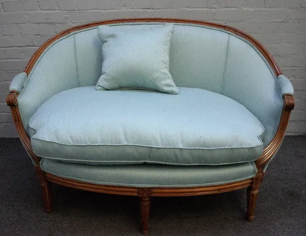 A small beech framed Louis XVI style tub back sofa on fluted supports, 135cm wide x 88cm high.