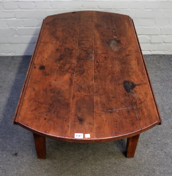 A 19th century French fruitwood oval drop flap table on tapering square supports, reduced to a coffee table, 116cm wide x 48cm high.