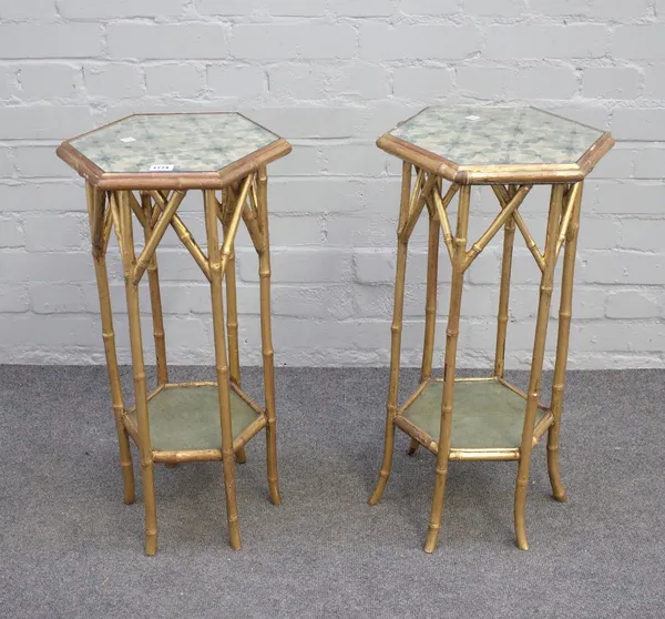 A pair of Victorian gold painted bamboo hexagonal two tier occasional tables, 36cm wide x 66cm high, (2).