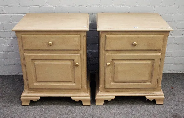 A pair of grey/green painted bedside tables with single drawer over cupboard on ogee bracket feet, 58cm wide x 71cm high.