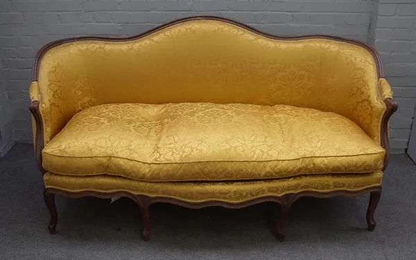 A Louis XV style tub back sofa, the shaped back over serpentine seat on eight shaped supports, 185cm wide x 101cm high.