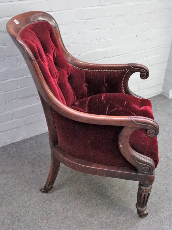 A William IV mahogany framed library bergere with scroll arms and tapering reeded supports, 60cm wide x 97cm high.