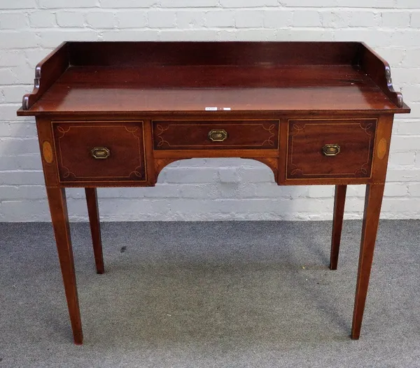 An Edwardian inlaid mahogany writing desk, the galleried back over three frieze drawers on tapering square supports, 108cm wide x 93cm high.