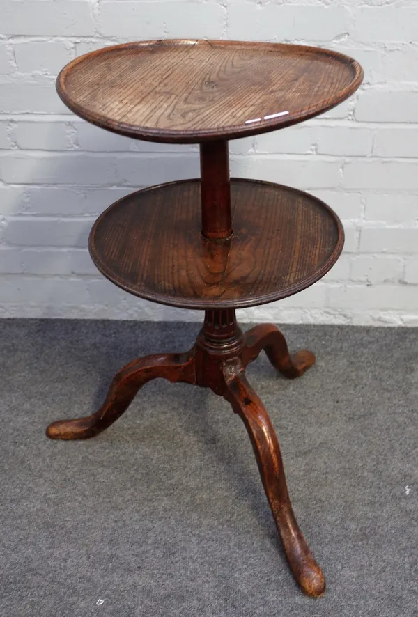 A provincial 18th century oak circular two tier dumbwaiter on tripod base, 40cm diameter x 72cm high.