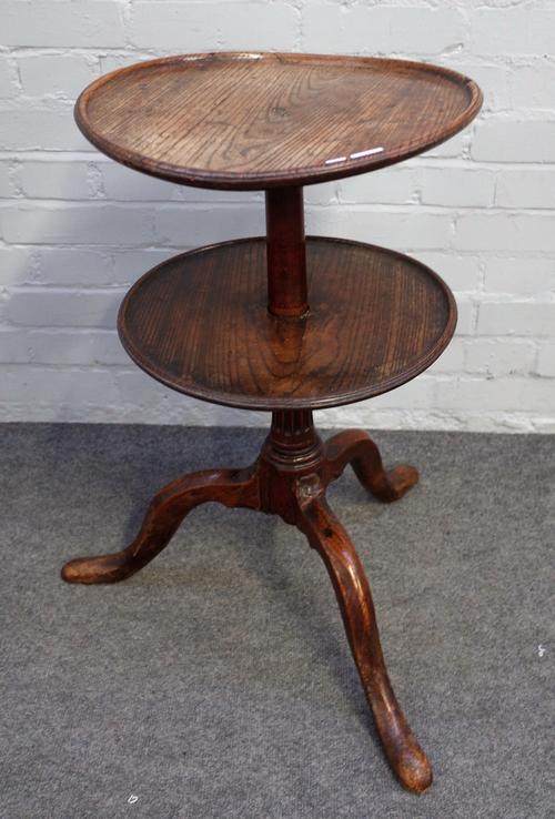 A provincial 18th century oak circular two tier dumbwaiter on tripod base, 40cm diameter x 72cm high.