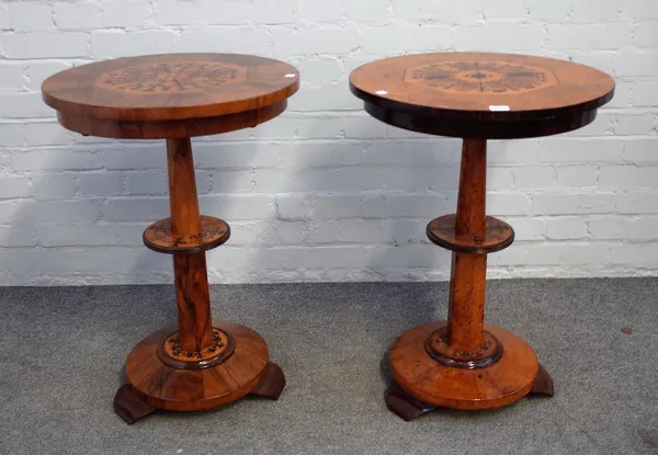 A near pair of Victorian amboyna and walnut circular marquetry inlaid occasional tables on turned columns and flared bases, 51cm wide x 71cm high. 688