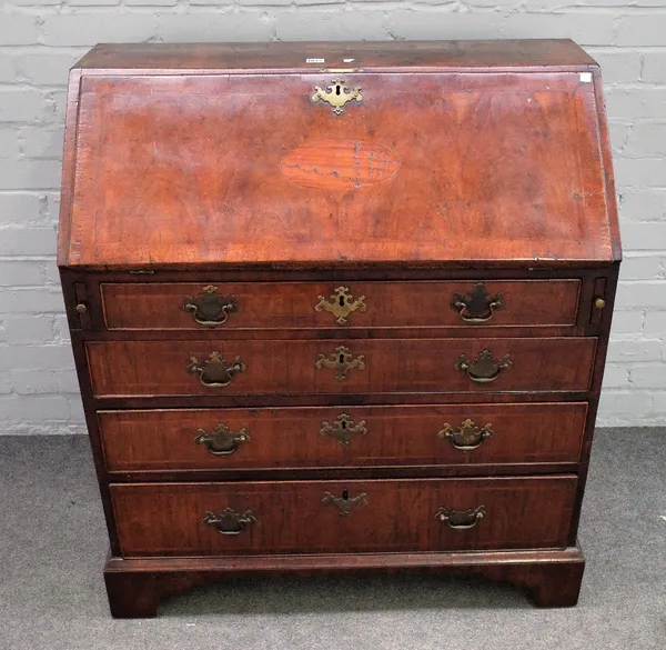 A George II inlaid walnut bureau, the fall over four long graduated drawers on bracket feet, 91cm wide x 102cm high.