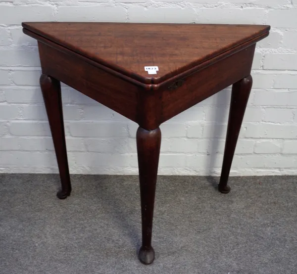 An 18th century oak corner/handkerchief foldover games table on club supports, 79cm wide x 71cm high.