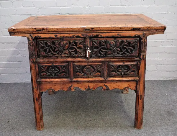 A late 19th century Chinese elm side table with pair of drawers over pierced frieze on block supports, 110cm wide x 84cm high.