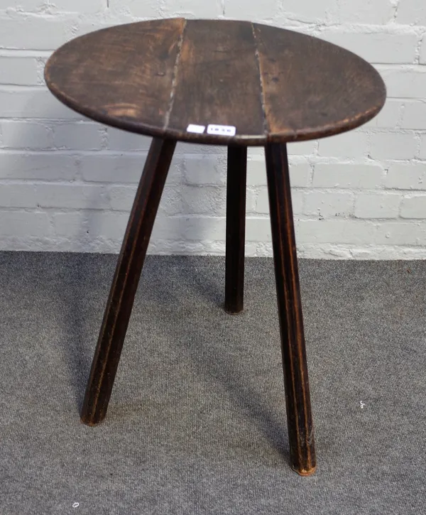 A 19th century cricket table, the circular top on three ash supports, 50cm diameter x 65cm high.