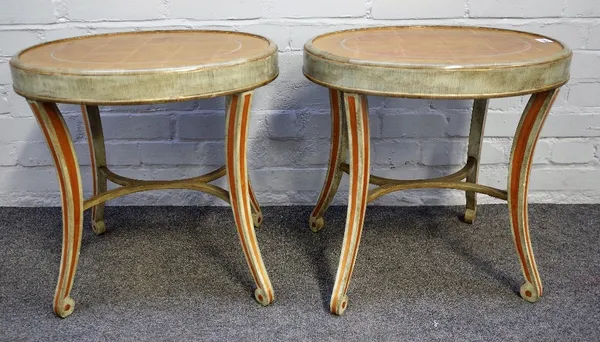 A pair of parcel gilt green painted oval occasional tables on four splayed supports, 51cm wide x 52cm high.