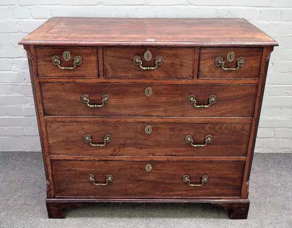 A George III mahogany chest, originally the upper part of a tallboy chest, with three short and three long drawers between fluted canted corners, late