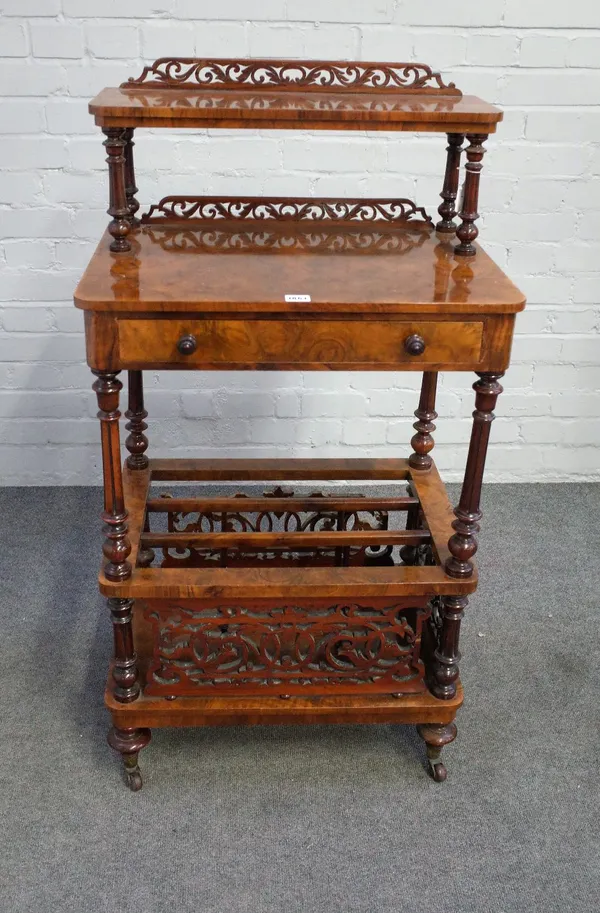 A Victorian burr walnut three tier Canterbury whatnot, fret carved and pierced, with frieze drawer and turned columns, 59cm high x 40cm deep x 111cm h