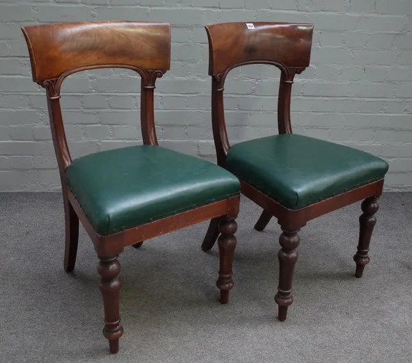 A set of eight early Victorian mahogany dining chairs, the arched open backs with deep curved top rails, stuff-over seats, on baluster turned legs, 50