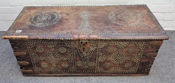 A Middle Eastern hardwood chest, 18th/19th century, the hinged top and front with brass studded decoration, 95cm wide x 42cm deep x 38cm high.