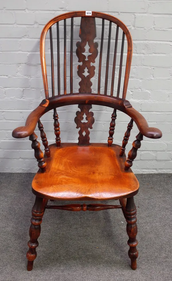 A Victorian Windsor chair with Yew hoop back and splat over elm seat on turned supports, 68cm wide x 116cm high.