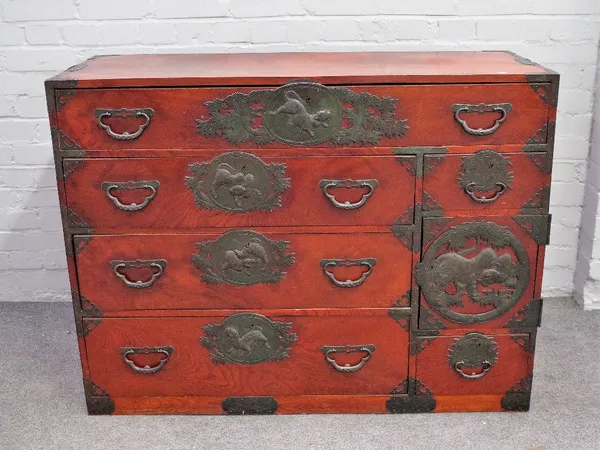 A pair of Japanese stained hardwood and metal mounted tansu's each with an arrangement of drawers and cupboards, 119cm wide x 90cm high. 6860