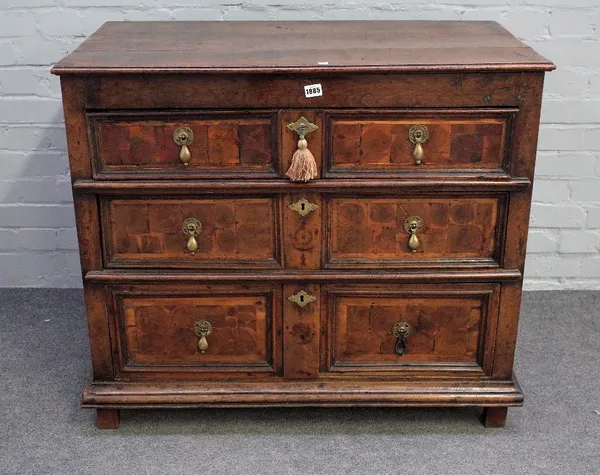 A late 17th century oak chest with three long graduated oyster veneered drawers, 94cm wide x 82cm high.