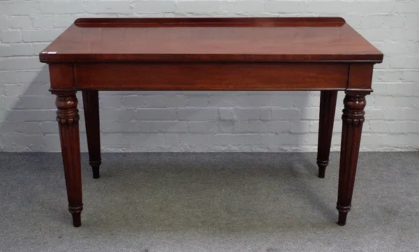 A George IV mahogany serving table, the rectangular top on tapering carved fluted supports, 137cm wide x 82cm high.